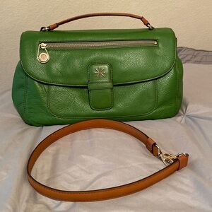 Talk about a pop of color! This beautiful green purse has never been used